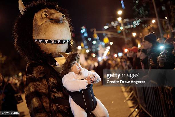 Revelers make their way along Sixth Avenue during the 43rd annual Village Halloween Parade, October 31, 2016 in New York City. Thousands of people...