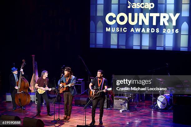 John Osborne and T.J. Osborne of Brothers Osborne and Sam Bush perform onstage during the 54th annual ASCAP Country Music awards at the Ryman...