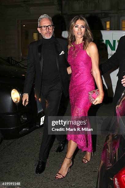 Patrick Cox and Elizabeth Hurley attending the Harper's Bazaar Women of the Year Awards on October 31, 2016 in London, England.