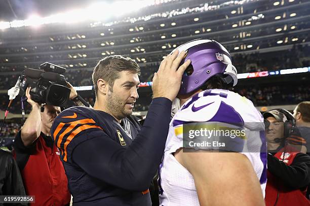 Jay Cutler of the Chicago Bears talks to Chad Greenway of the Minnesota Vikings after the Chicago Bears defeated the Minnesota Vikings 20-10 at...