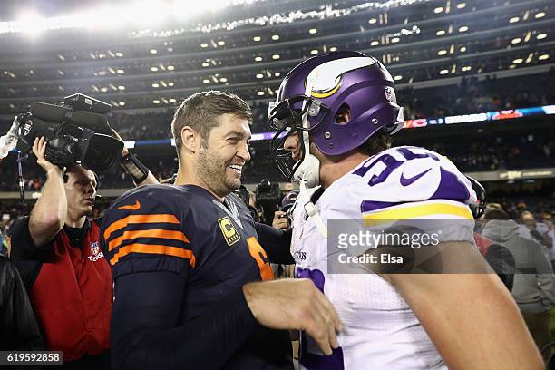 Jay Cutler of the Chicago Bears talks to Chad Greenway of the Minnesota Vikings after the Chicago Bears defeated the Minnesota Vikings 20-10 at...