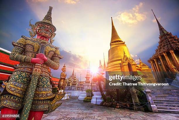 travel concept, giant statue at temple wat pra kaew, grand palace, bangkok thailand - wat stock pictures, royalty-free photos & images