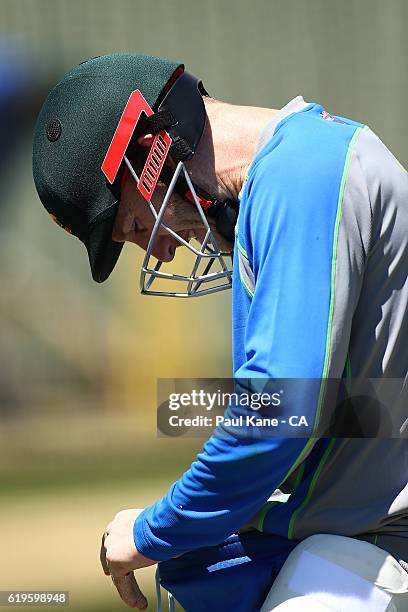 Peter Nevill of Australia inspects himself after being struck by a ball during the Australian Test Team Nets Session at the WACA on November 1, 2016...