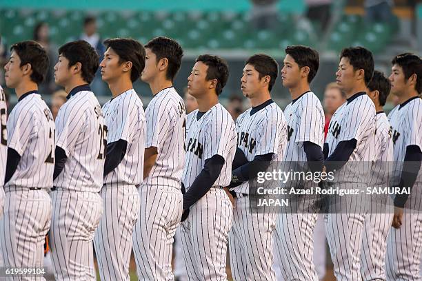 Players of Japan listen to their national anthem prior the WBSC U-23 Baseball World Cup Group B game between Austria and Japan at Estadio de Beisbol...