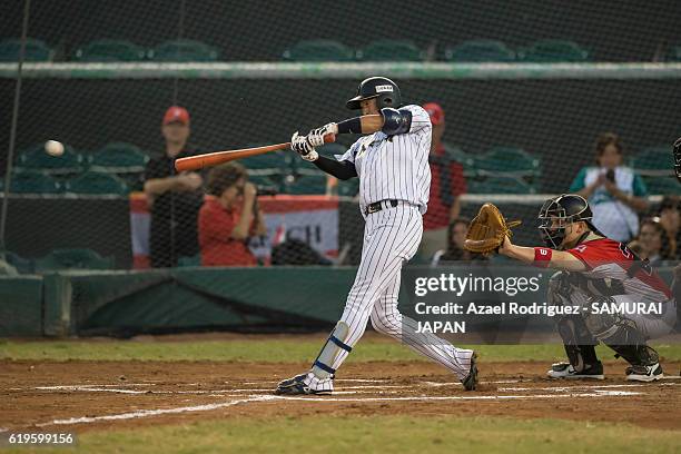 Kengo Takeda of Japan hits the ball on the first inning during the WBSC U-23 Baseball World Cup Group B game between Austria and Japan at Estadio de...