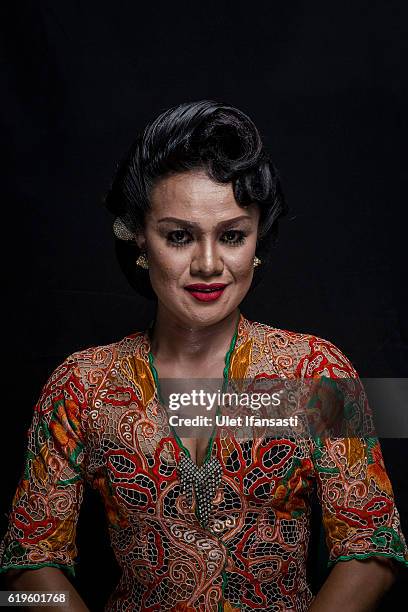 Transvestite Roro , poses to photograph before performing a traditional dance opera known as Ludruk on October 30, 2016 in Surabaya, Indonesia....