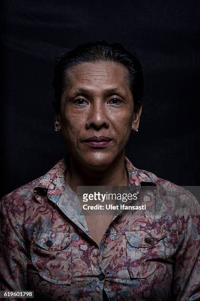 Transvestite Pur , poses to photograph before performing a traditional dance opera known as Ludruk on October 29, 2016 in Surabaya, Indonesia....