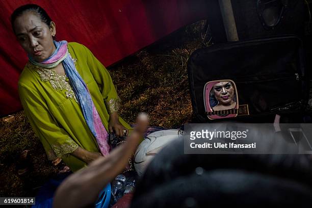 Transvestite Suhar Tatik , prepares backstage before performing a traditional dance opera known as Ludruk on October 29, 2016 in Surabaya, Indonesia....