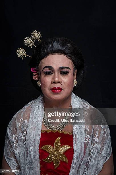 Transvestite Lamiyati , poses to photograph before performing a traditional dance opera known as Ludruk on October 30, 2016 in Surabaya, Indonesia....