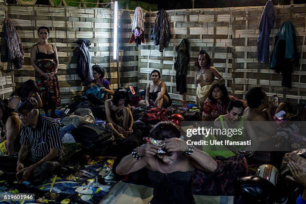 Transvestites are prepare on the backstage before they perform a traditional dance opera known as Ludruk on October 29, 2016 in Surabaya, Indonesia....