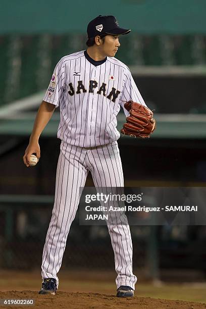 Akiyoshi Katsuno of Japan prepares to pitch on the fourth inning during the WBSC U-23 Baseball World Cup Group B game between Austria and Japan at...