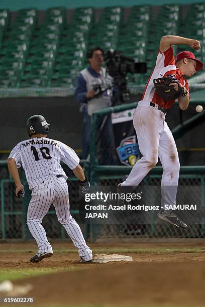 Koki Yamashita of Japan observes the player of Austria loose the ball and runs to second base on the fourth inning during the WBSC U-23 Baseball...