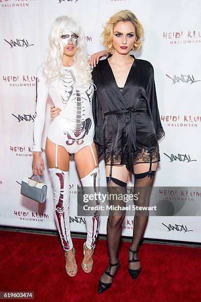 Models Alina Baikova and Andreja Pejic attend Heidi Klum's 17th Annual Halloween party at Vandal on October 31, 2016 in New York City.