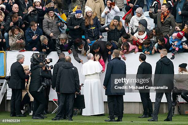 Pope Francis greets participants as he arrives for the Holy Mass at the Swedbank Stadion on November 1, 2016 in Malmo, Sweden. The Pope is on 2 days...