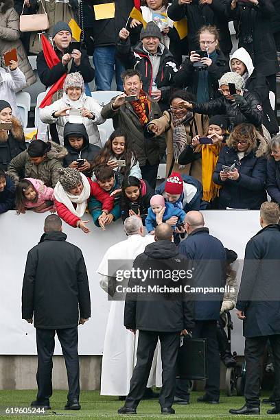 Pope Francis greets participants as he arrives for the Holy Mass at the Swedbank Stadion on November 1, 2016 in Malmo, Sweden. The Pope is on 2 days...