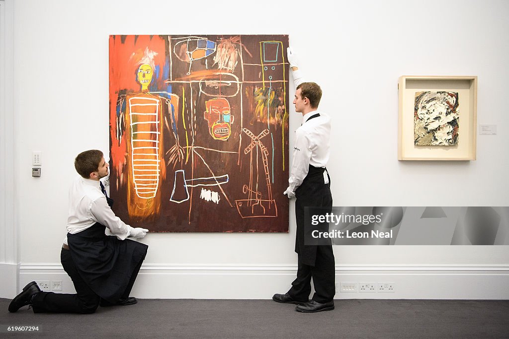 Two gallery assistants pose with Air Power by Jean-Michel Basquiat  News Photo - Getty Images