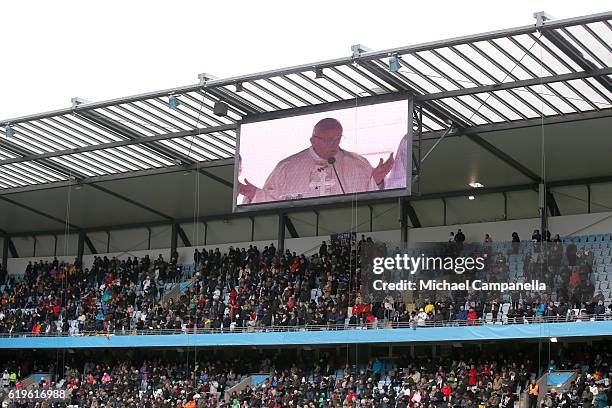 Pope Francis is seen on a public viewing screen during the Holy Mass at the Swedbank Stadion on November 1, 2016 in Malmo, Sweden. The Pope is on 2...