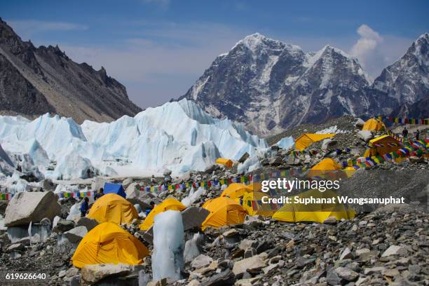 view from mount everest base camp, yellow tents and prayer flags trek to everest base camp - nepal - everest stock pictures, royalty-free photos & images