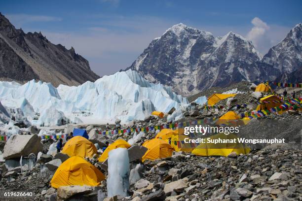 view from mount everest base camp, yellow tents and prayer flags trek to everest base camp - nepal - khumbu bildbanksfoton och bilder