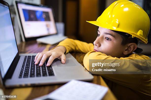 young constructor thinking about the project - child architect stock pictures, royalty-free photos & images