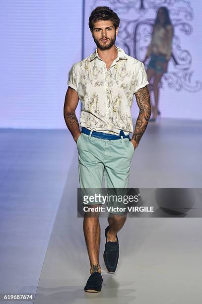 Model walks the runway during the Samuel Cirnansk show at Sao Paulo Fashion Week Fall/Winter 2017 on October 27, 2016 in Sao Paulo, Brazil.