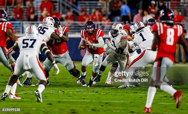 Quarterback Chad Kelly of the Mississippi Rebels scrambles for yardage during the first half of an NCAA college football game against the Auburn...
