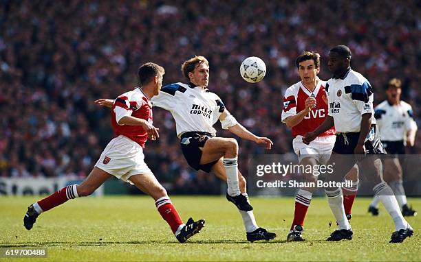 Kevin Richardson of Aston Villa in action watched by Ian Sellley Alan Smith and Dalian Atkinson during a Premier League match between Arsenal and...