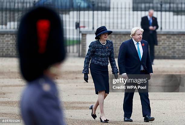 British Prime Minister Theresa May and Foreign Secretary Boris Johnson arrive to take part in a ceremonial welcome for Colombia's President Juan...