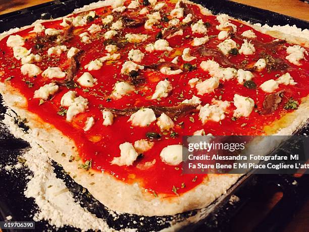 pizza with anchovies and capers - emozione stock-fotos und bilder