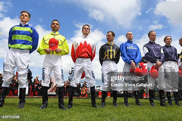 Nick Hall, Joao Moreira, Vlad Duric, Damian Lane, Kerrin McEvoy and Katelyn Mallyon pose during the pre race entertainment on Melbourne Cup Day at...