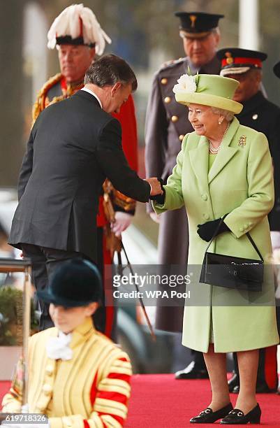 Queen Elizabeth II greets Colombia's President Juan Manuel Santos at a ceremonial welcome for Colombia's President Juan Manuel Santos and his wife...