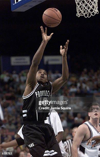 Brandon Watkins of Providence shoots against Penn State during the Men's NCAA South Region First Round Game at the Lousiana Superdome in New Orleans,...