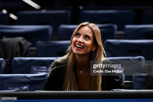 Ester Satorova, the wife of Tomas Berdych of the Czech Republic, watches his men's singles second round match against Joao Sousa of Portugal on day...