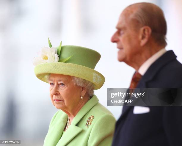 Britain's Queen Elizabeth II and Prince Philip, Duke of Edinburgh await the arrival of Colombia's president Juan Manuel Santos for ceremonial welcome...