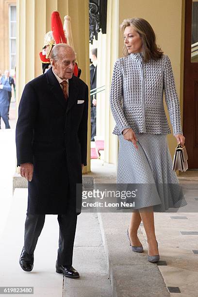 Prince Philip, Duke of Edinburgh walks with the President of Colombia's wife Maria Clemencia de Santos after arriving at Buckingham Palace on...