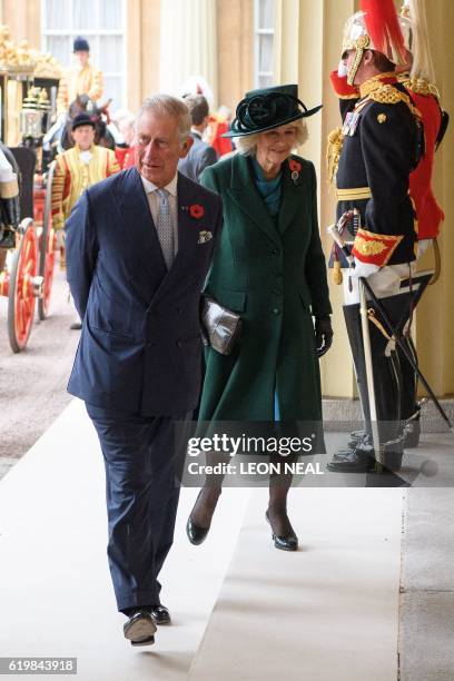 Britain's Prince Charles and Camilla, Duchess of Cornwall arrive at Buckingham Palace after a welcoming ceremony for Colombian President Juan Manuel...