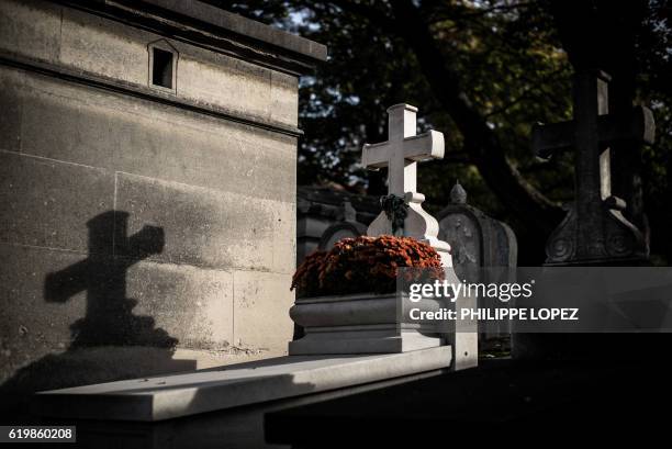 Picture taken at the Pere Lachaise cemetery in Paris on November 1, 2016 during All Saints' Day in Paris shows a grave.