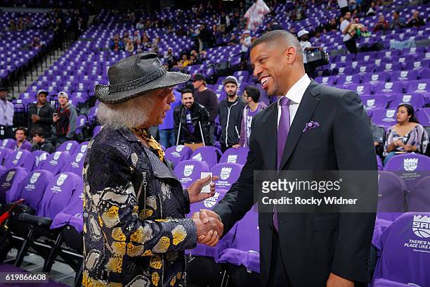 Superfan Jimmy Goldstein shakes hands with Sacramento mayor Kevin Johnson prior to the game between the San Antonio Spurs and Sacramento Kings on...
