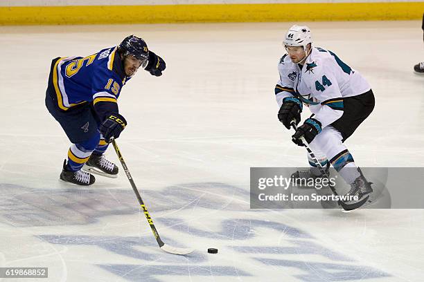 St. Louis Blues center Robby Fabbri and San Jose Sharks defenseman Marc-Edouard Vlasic battle for the puck during game two of the Western Conference...