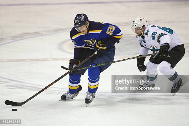 St. Louis Blues defenseman Colton Parayko and San Jose Sharks right wing Melker Karlsson battle for the puckduring game two of the Western Conference...