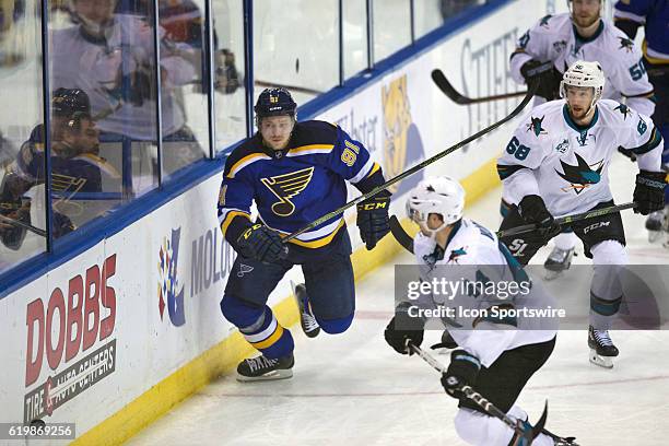 St. Louis Blues right wing Vladimir Tarasenko and San Jose Sharks defenseman Marc-Edouard Vlasic heads for the puck during game two of the Western...