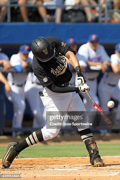 Julian Infante of Vanderbilt drills a home run out of the stadium and then rounds the bases during the NCAA regular season game between Vanderbilt...
