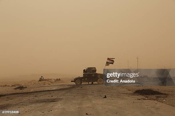 View of Mosul-Erbil Highway, secured by Iraqi army members, during a sandstorm near Tehrawa village between Bertilla and Kokceli, as the operation to...