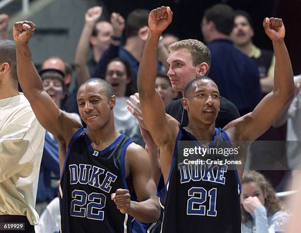 Jason Williams and Chris Duhon of the Duke Blue Devils celebrate their 79-53 victory over the North Carolina Tar Heels during the ACC Tournament...