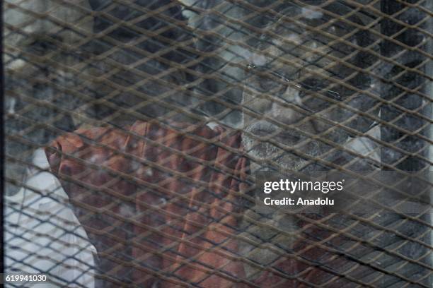 General Guide of the Egyptian Muslim Brotherhood Mohammed Badie is seen during the trial over the breaking up the Rabaa el-Adaweya protests, at the...