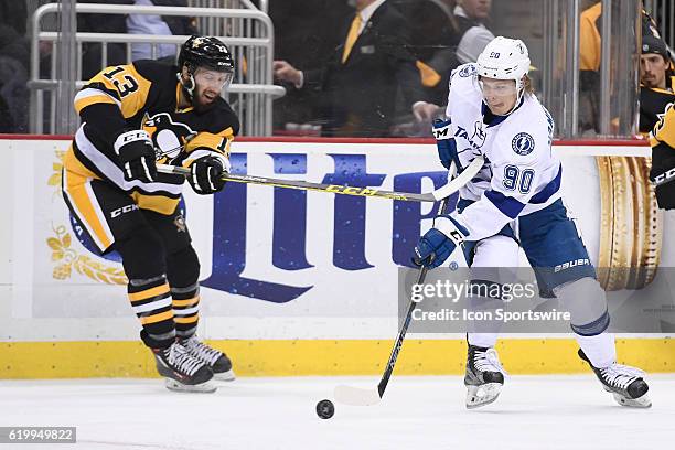 Tampa Bay Lightning center Vladislav Namestnikov moves the puck as Pittsburgh Penguins center Nick Bonino defends during the third period. The Tampa...