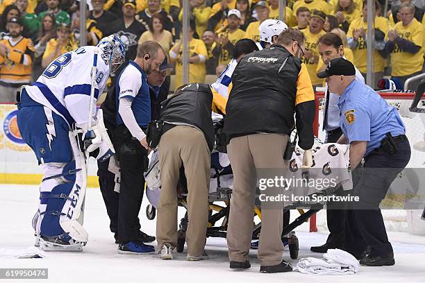 Tampa Bay Lightning goalie Andrei Vasilevskiy watches as Tampa Bay Lightning goalie Ben Bishop leaves the ice on a stretcher after suffering an...