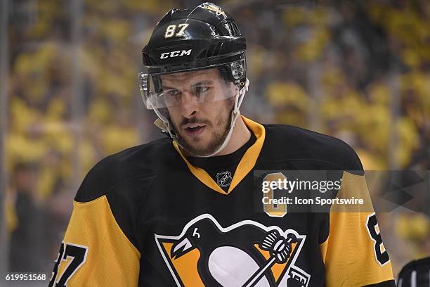 Pittsburgh Penguins center Sidney Crosby on the ice watches as teammate Kris Letang lies on the ice with an apparent injury during the first period....