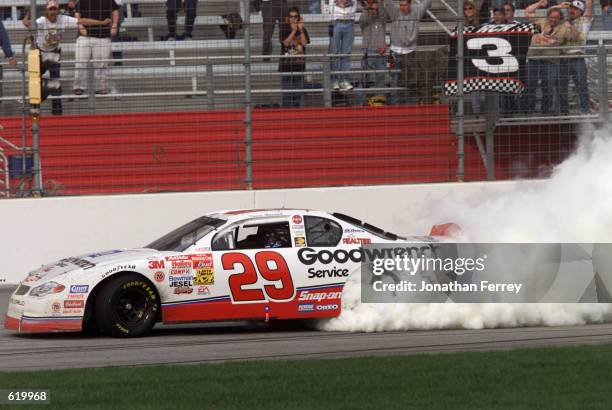 Kevin Harvick in the Childres Racing Chevrolet Monte Carlo celebrates by doing donuts after winning the Winston Cup Cracker Barrel 500 at Atlanta...