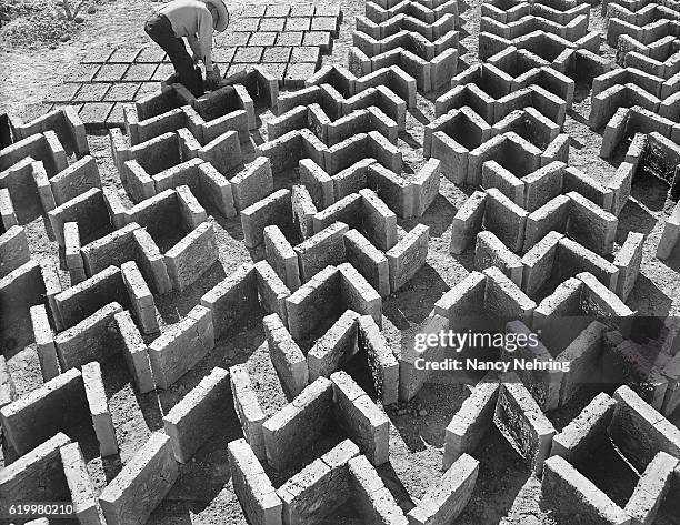 making adobe bricks - herringbone brick stock pictures, royalty-free photos & images
